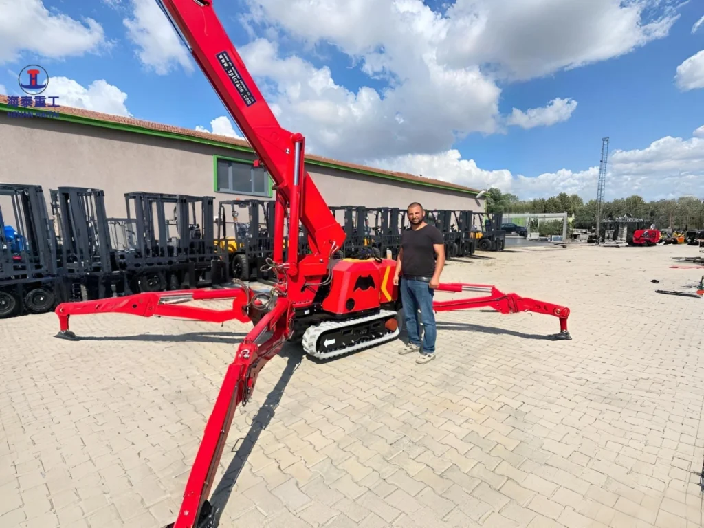 Haitai 0.5 ton SPT299 spider crane lifting a load at a customer site in Turkey, 2020