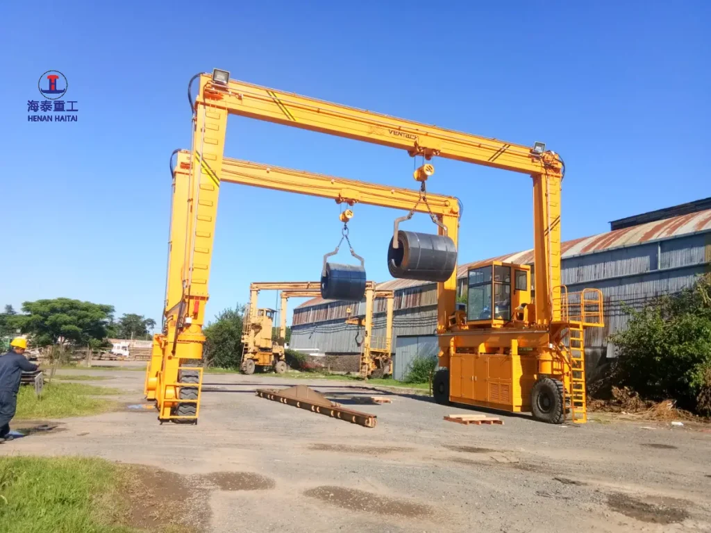 Haitai 12.5+12.5 ton dual-hoist RTG crane lifting steel bar stock at a customer yard in Argentina, 2018