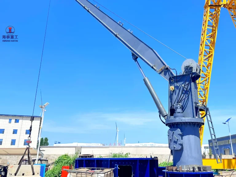 Hydraulic stiff boom marine crane undergoing testing in Haitai's manufacturing yard before shipment