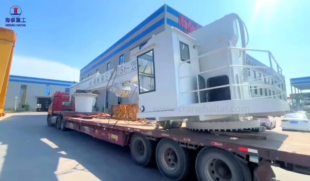 Haitai marine crane secured on trailer for export shipment to Romania
