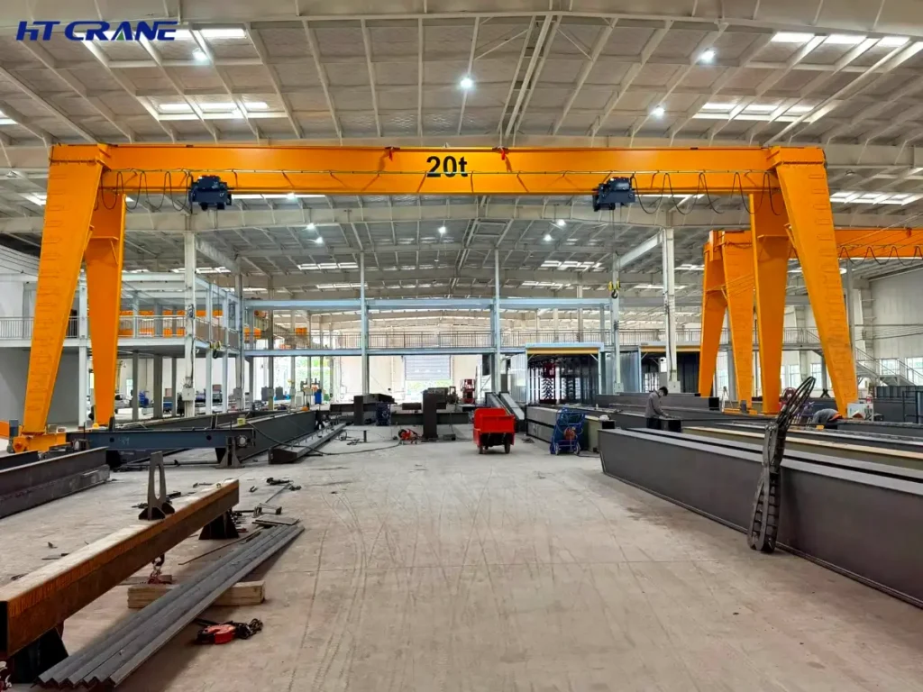 Single girder box-section gantry crane rated 20t inside an indoor steel fabrication workshop