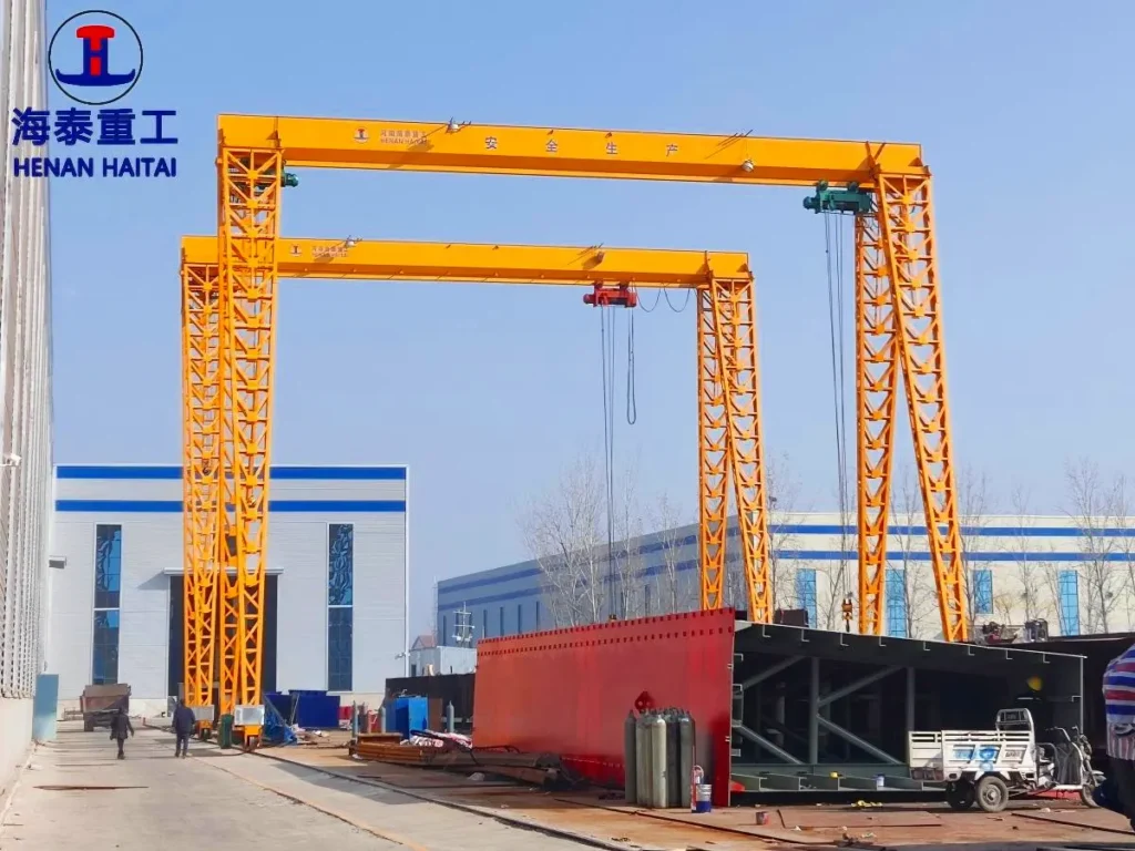 Haitai single girder gantry cranes with electric hoists at the manufacturer's fabrication yard